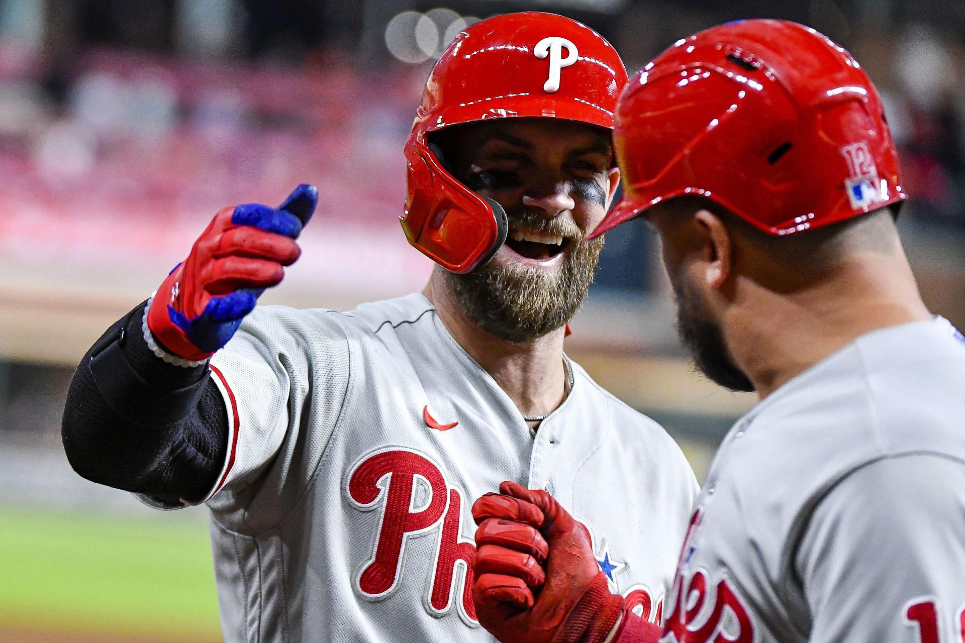 Bryce Harper congratulates Kyle Schwarber after Schwarber hit a homerun against the Houston Astros